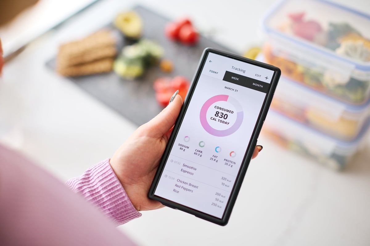 A person reviewing editable food estimates on the FO-CAL app at home